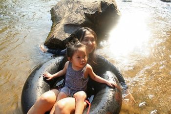 Tubing and swimming change the chemistry and microbiome of streams